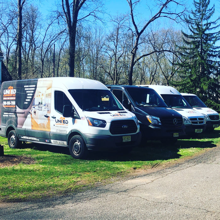 United Carpentry, LLC owner Leo Da Silva and company vehicles